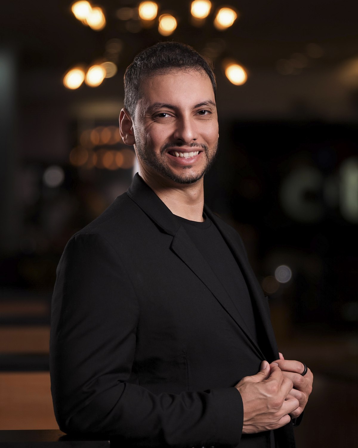 Diego Araujo, smiling in a black blazer