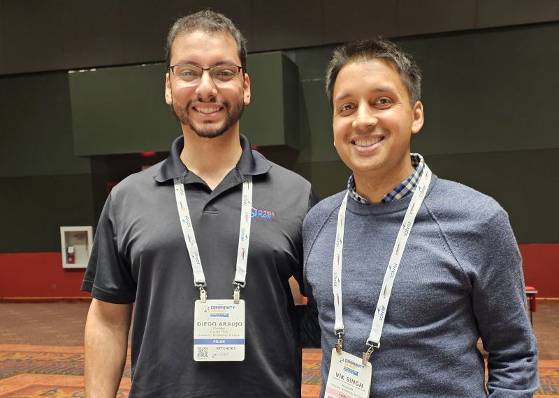 Diego Araujo with Vik Singh at Community Summit North America in 2024
